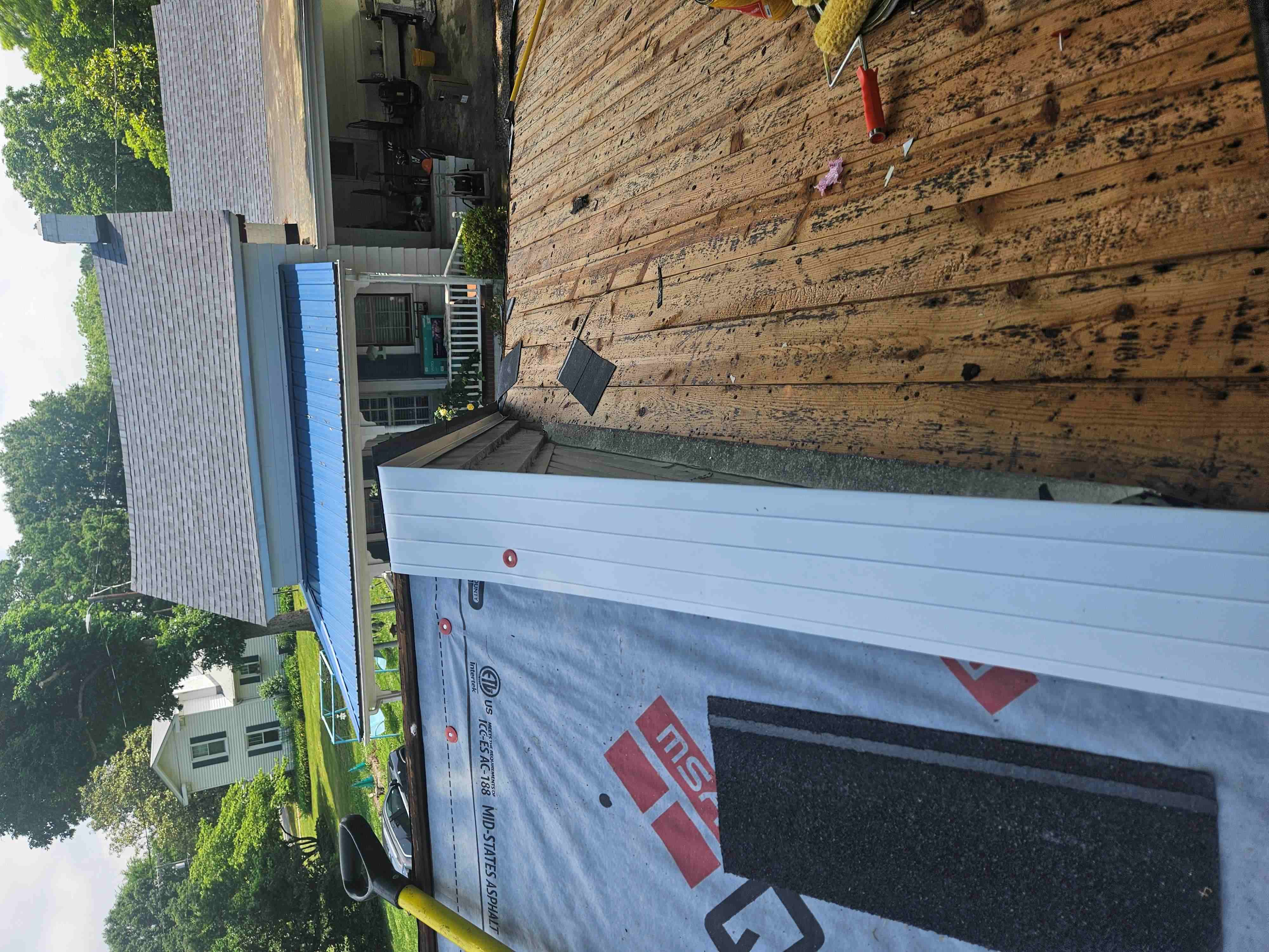 Fresh roof decking with new white drip edge installed along the eave in Winston-Salem NC