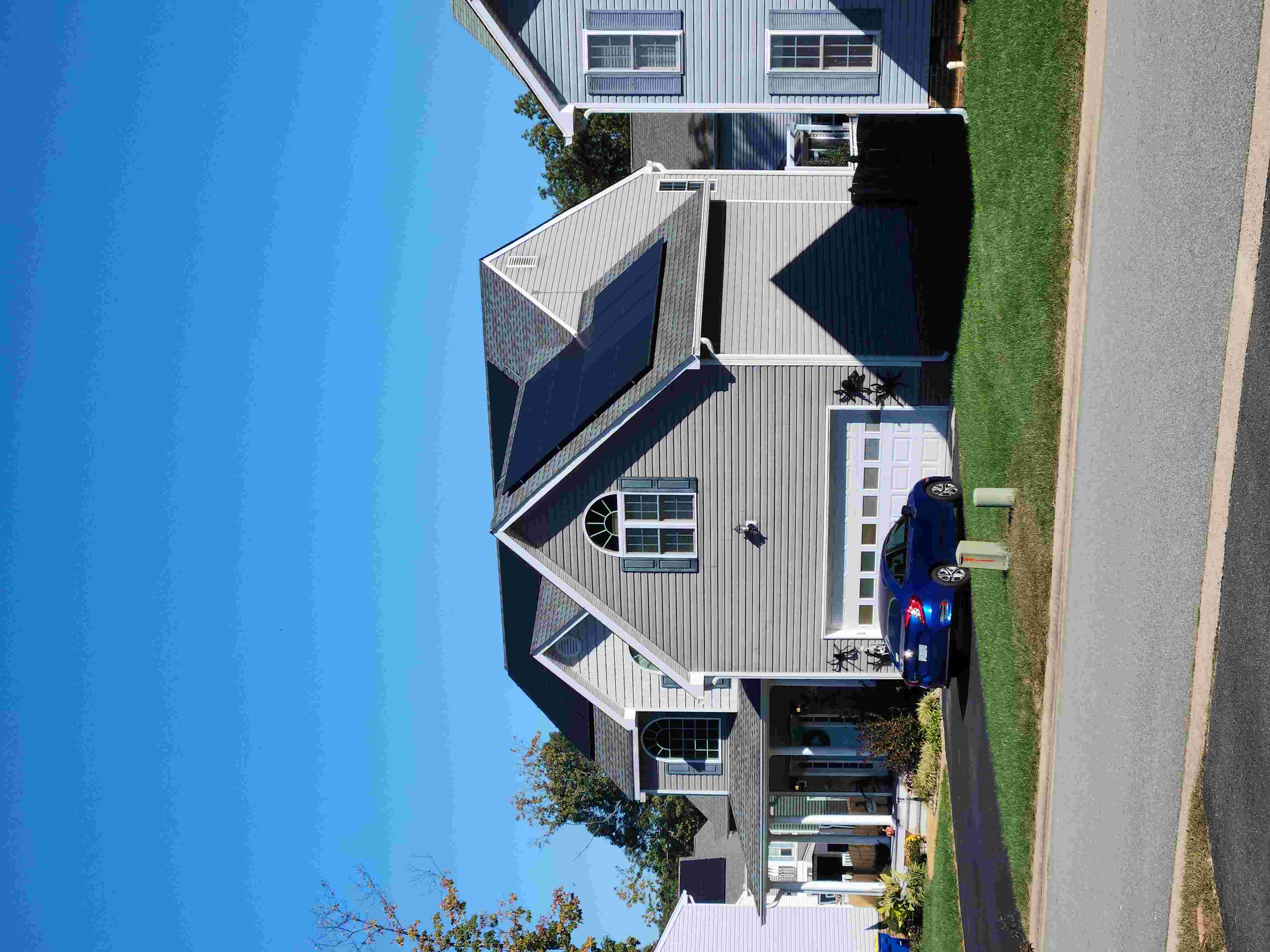 Professional solar panel cleaning on a roof in Winston-Salem NC